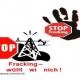 "Stop"-Zeichen mit Förderturm, Schriftzug: "Fracking wüllt wi nich!"